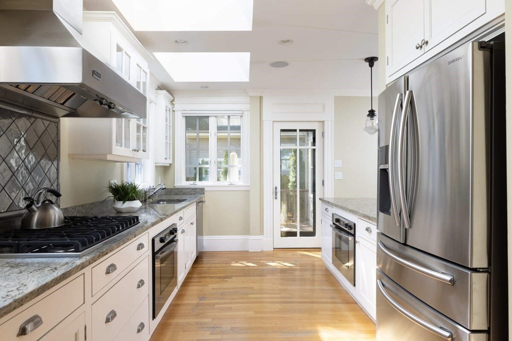12 Balcarres Road Newton, MA 02465 - Photo 8 of 22 a kitchen with stainless steel appliances granite countertop a refrigerator and a sink
