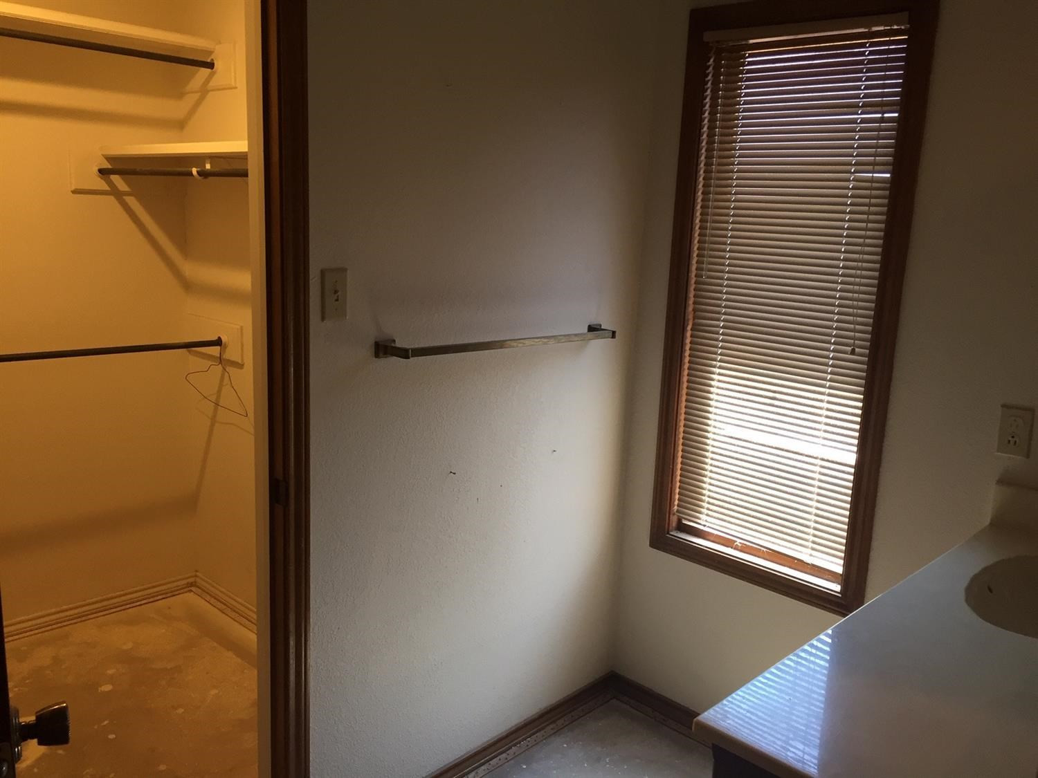 5708 91st Street Lubbock, TX 79424 - Photo 16 of 16 a view of a hallway with windows