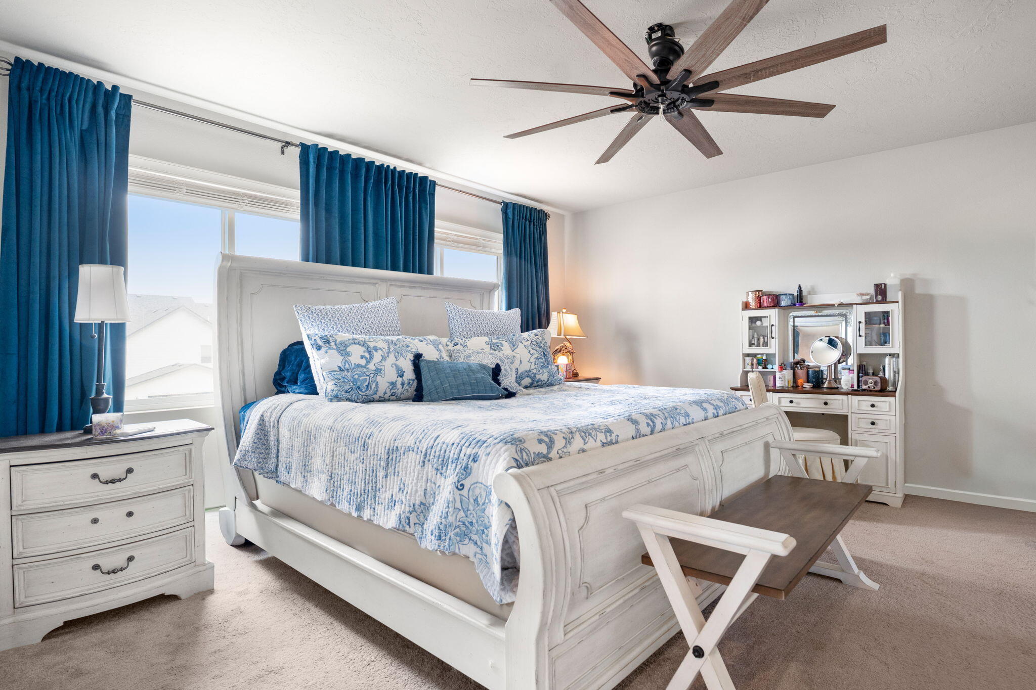 4039 Southwest Quartz Place Redmond, OR 97756 - Photo 30 of 44 a bedroom with a bed and a chandelier
