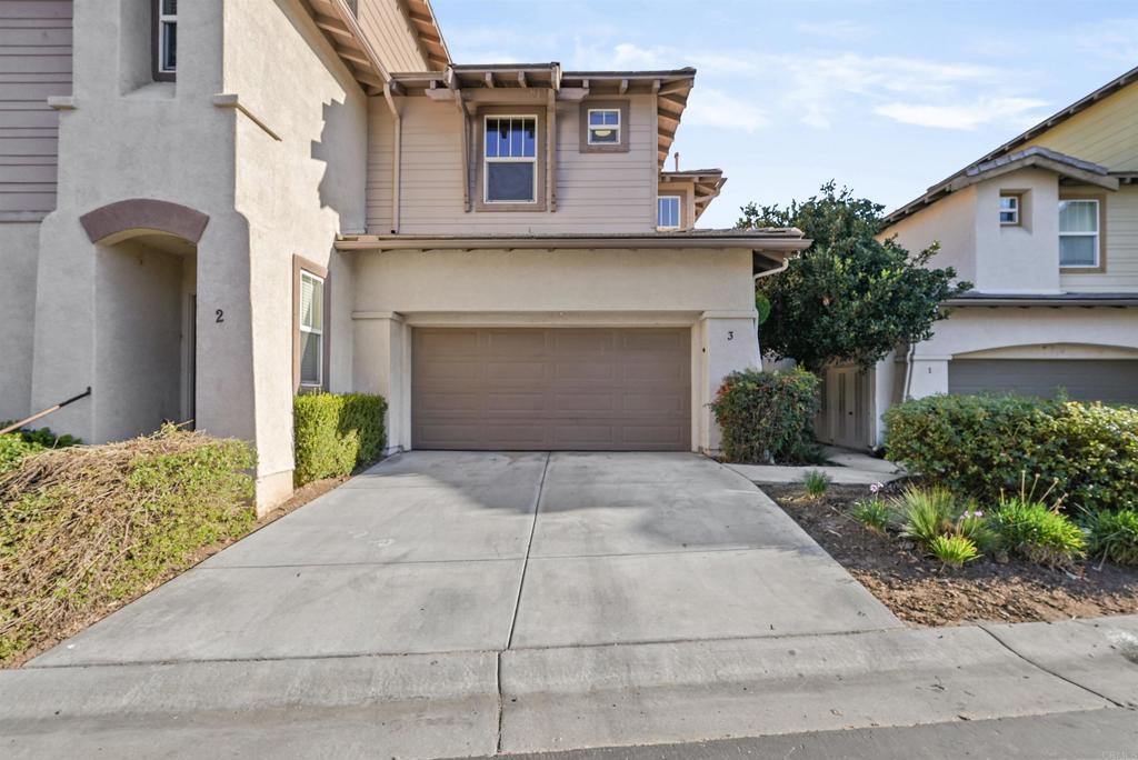 41764 Ridgewalk Street, Unit 3 Murrieta, CA 92562 - Photo 1 of 1 a front view of a house with a yard and garage