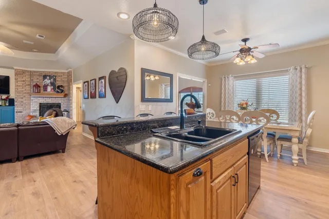 a view of a dining room with furniture and chandelier