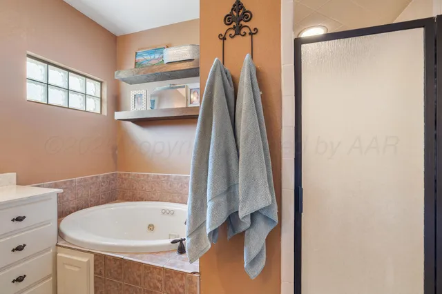 a bedroom with a bed and a cabinets