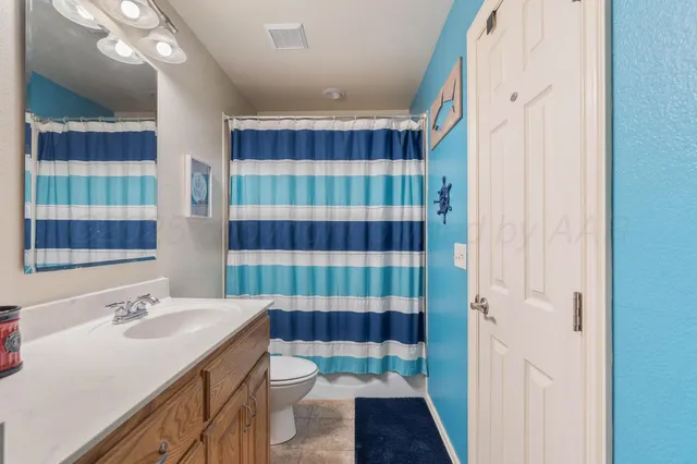 a bathroom with a shower and a glass door