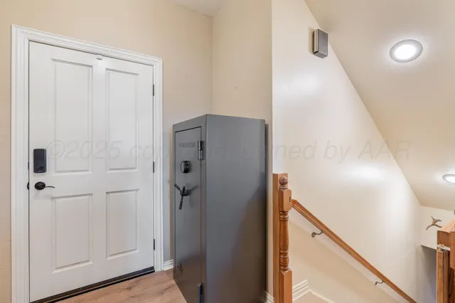 a bathroom with a sink vanity mirror and toilet