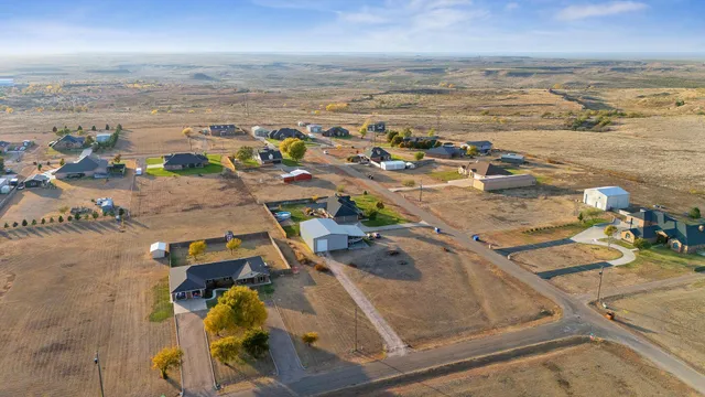 a view of a backyard of the house