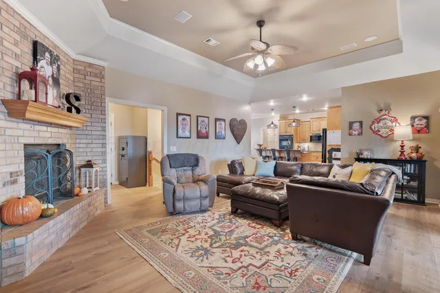 a living room with furniture a large window and a flat screen tv