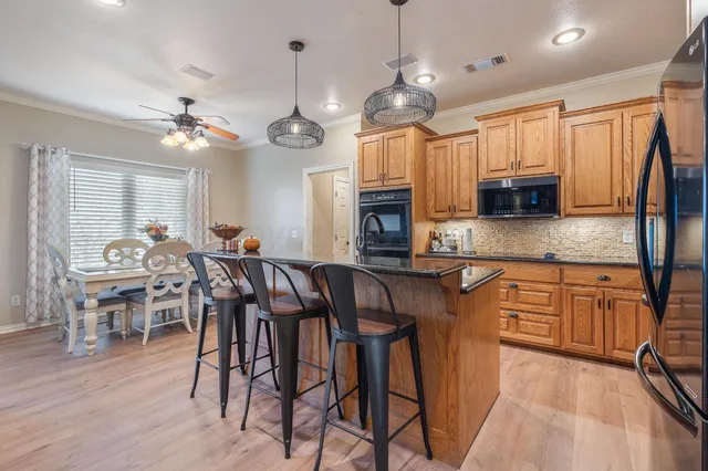a kitchen with sink a counter and cabinets