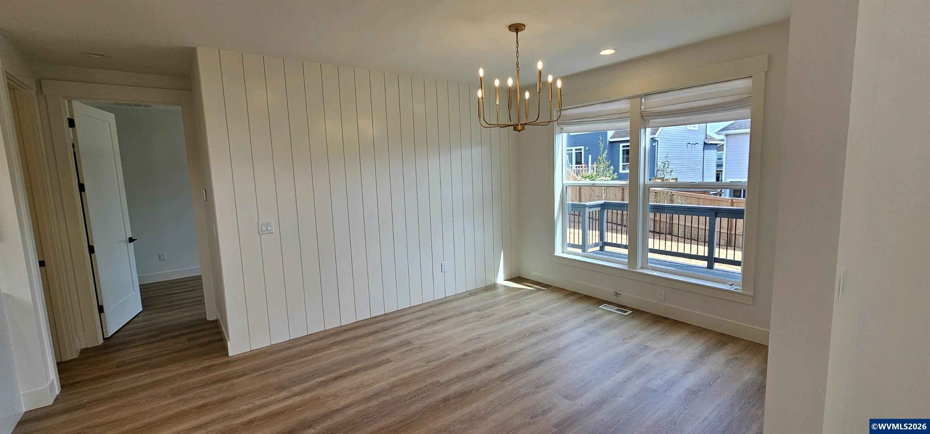 Model B Salishan Street Southeast Salem, OR 97302 - Photo 2 of 30 a view of an empty room with wooden floor and a window