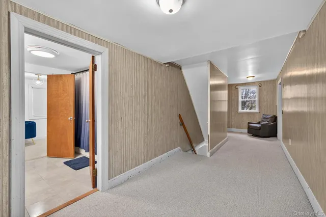 a view of a livingroom with a staircase