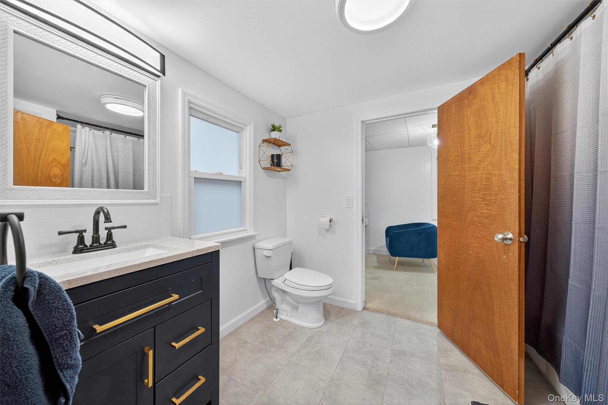 493 Gate Hill Coop Road Stony Point, NY 10980 - Photo 19 of 33 a bathroom with a granite countertop sink toilet and shower