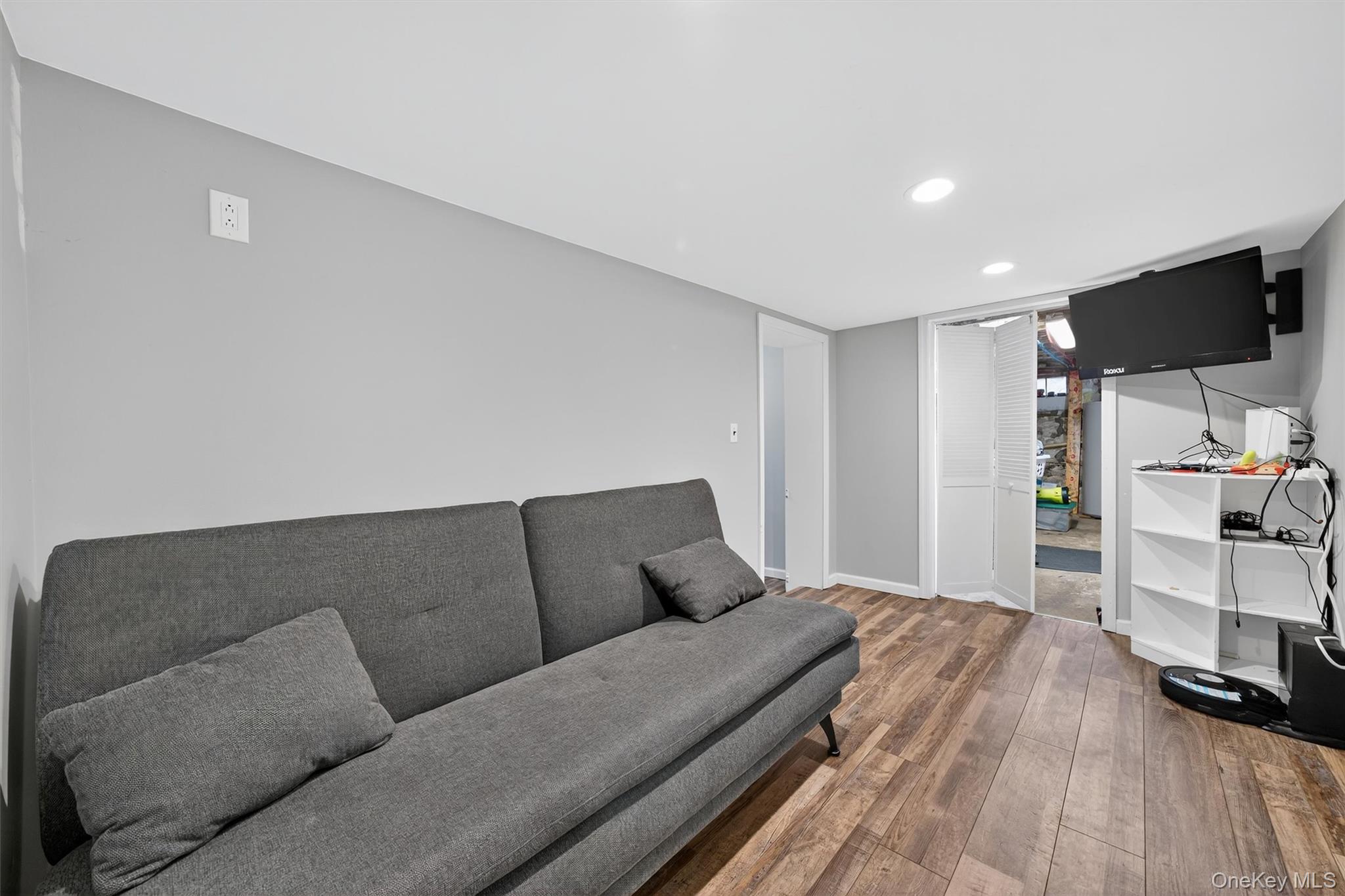 493 Gate Hill Coop Road Stony Point, NY 10980 - Photo 26 of 33 a living room with a couch and a flat screen tv