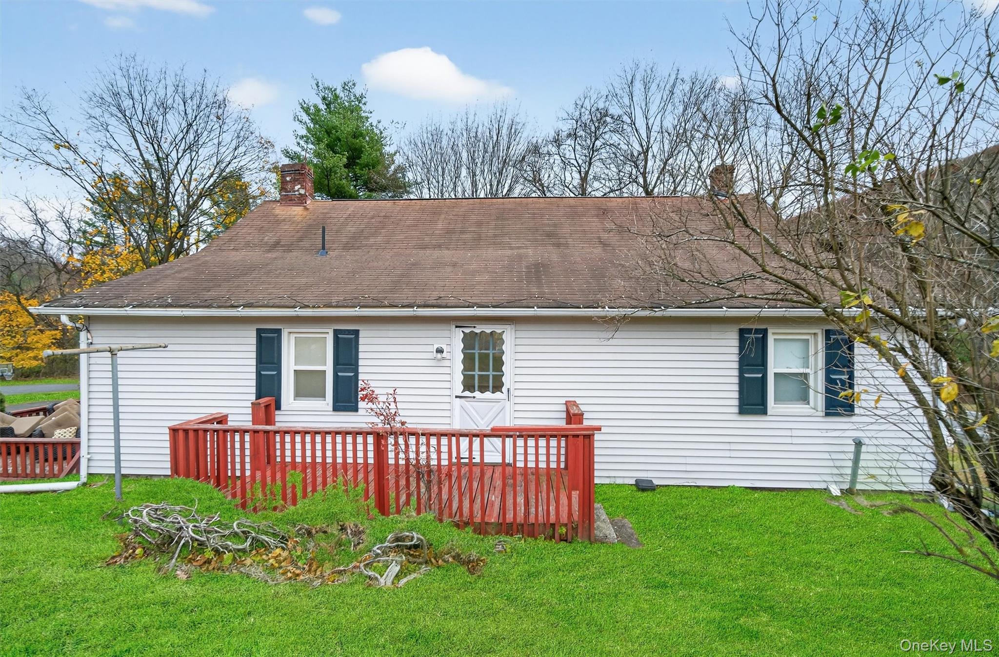 493 Gate Hill Coop Road Stony Point, NY 10980 - Photo 28 of 33 a view of a house with a yard and deck