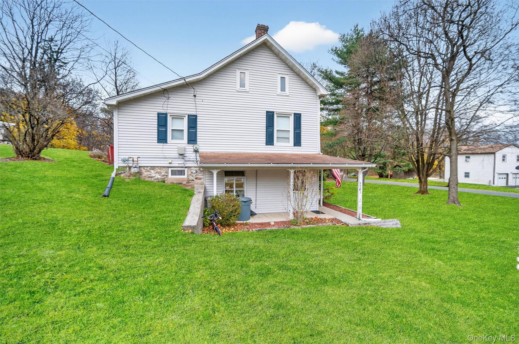 493 Gate Hill Coop Road Stony Point, NY 10980 - Photo 29 of 33 a view of a house with a yard and sitting area