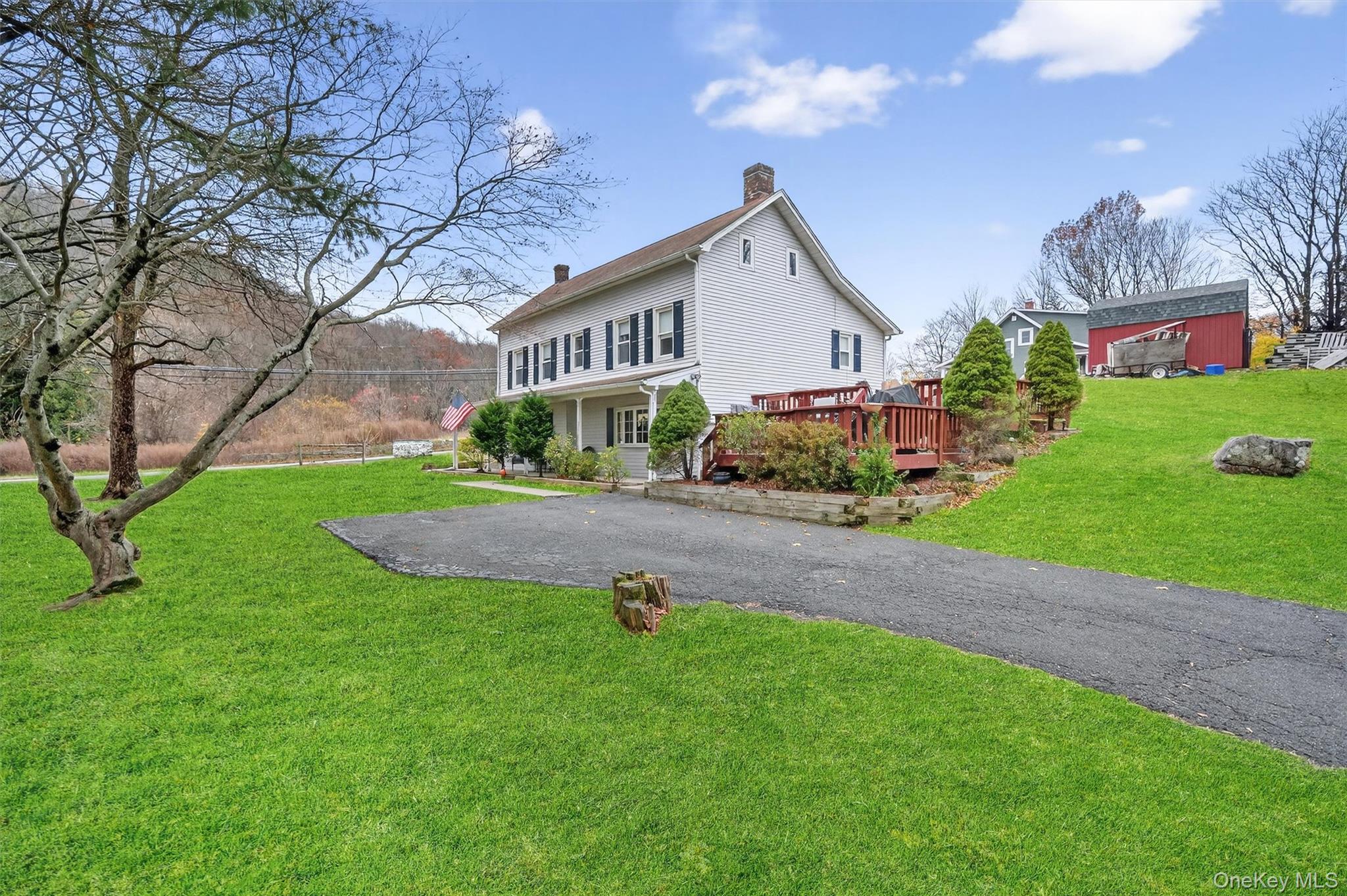 493 Gate Hill Coop Road Stony Point, NY 10980 - Photo 5 of 33 a front view of a house with garden