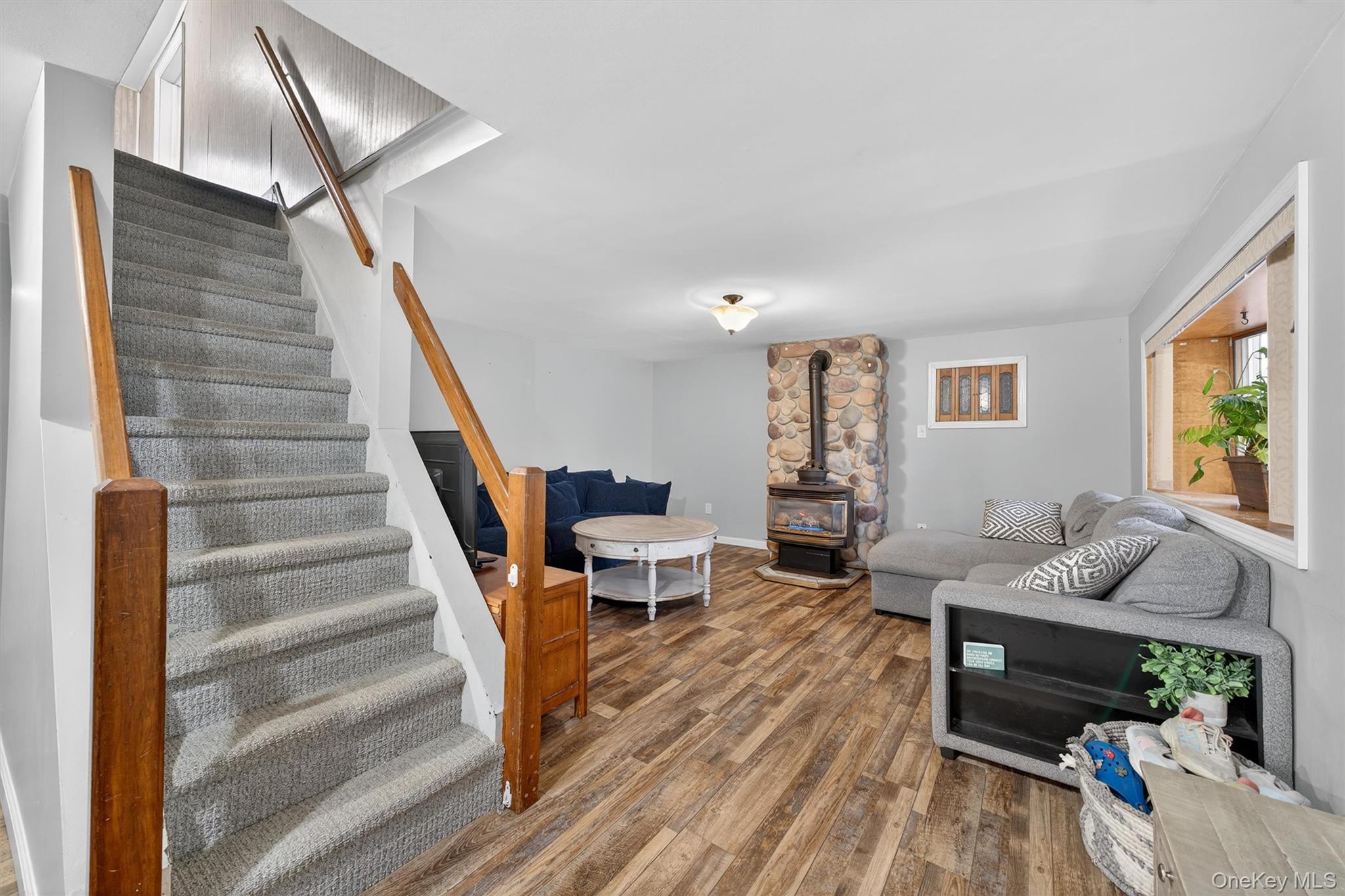 493 Gate Hill Coop Road Stony Point, NY 10980 - Photo 6 of 33 a living room with furniture and a wooden floor