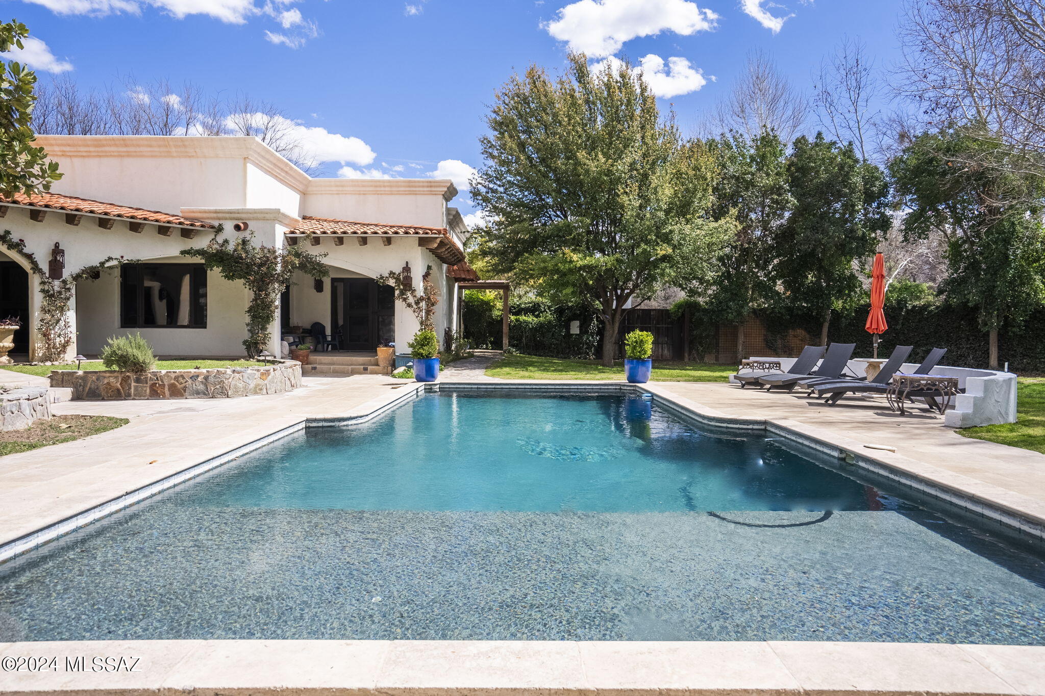 45 Clark Crossing Road Tumacacori, AZ 85640 - Photo 27 of 50 a view of a swimming pool with a patio