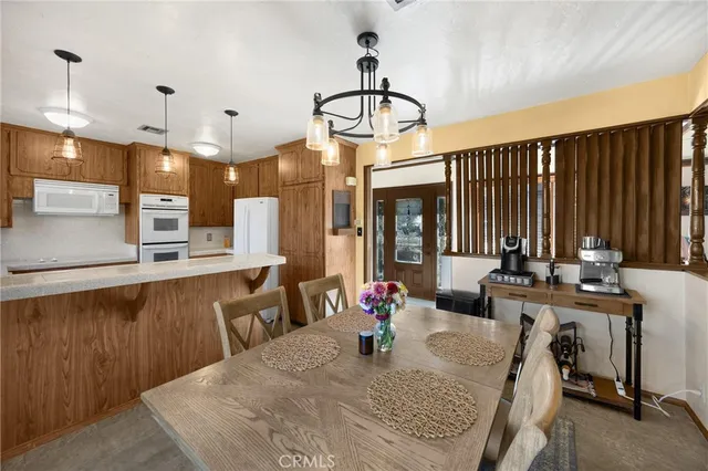 a kitchen with a sink stove and microwave