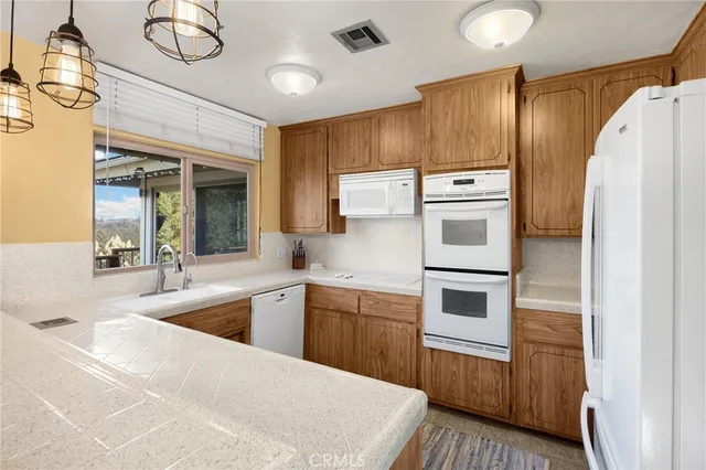 a spacious bedroom with a bed and a couch