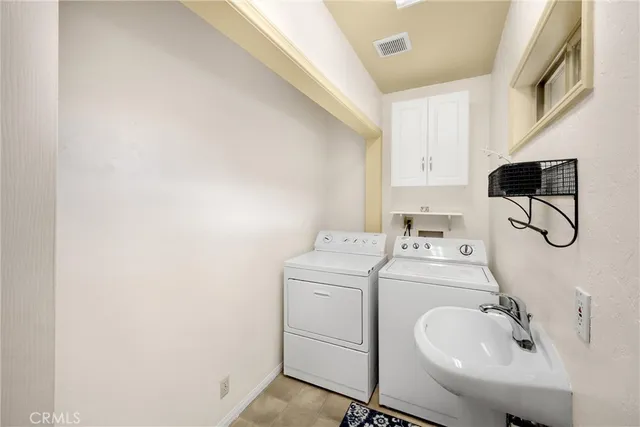 a spacious bedroom with a bed and large windows