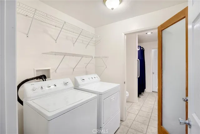 a kitchen with a stove a sink and a wooden cabinets