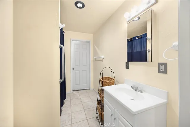 a kitchen with a sink cabinets and wooden floor