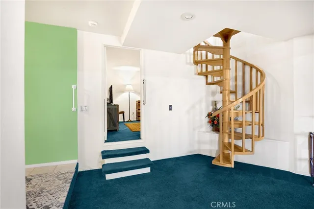 a very nice looking room with a large window and gym equipment