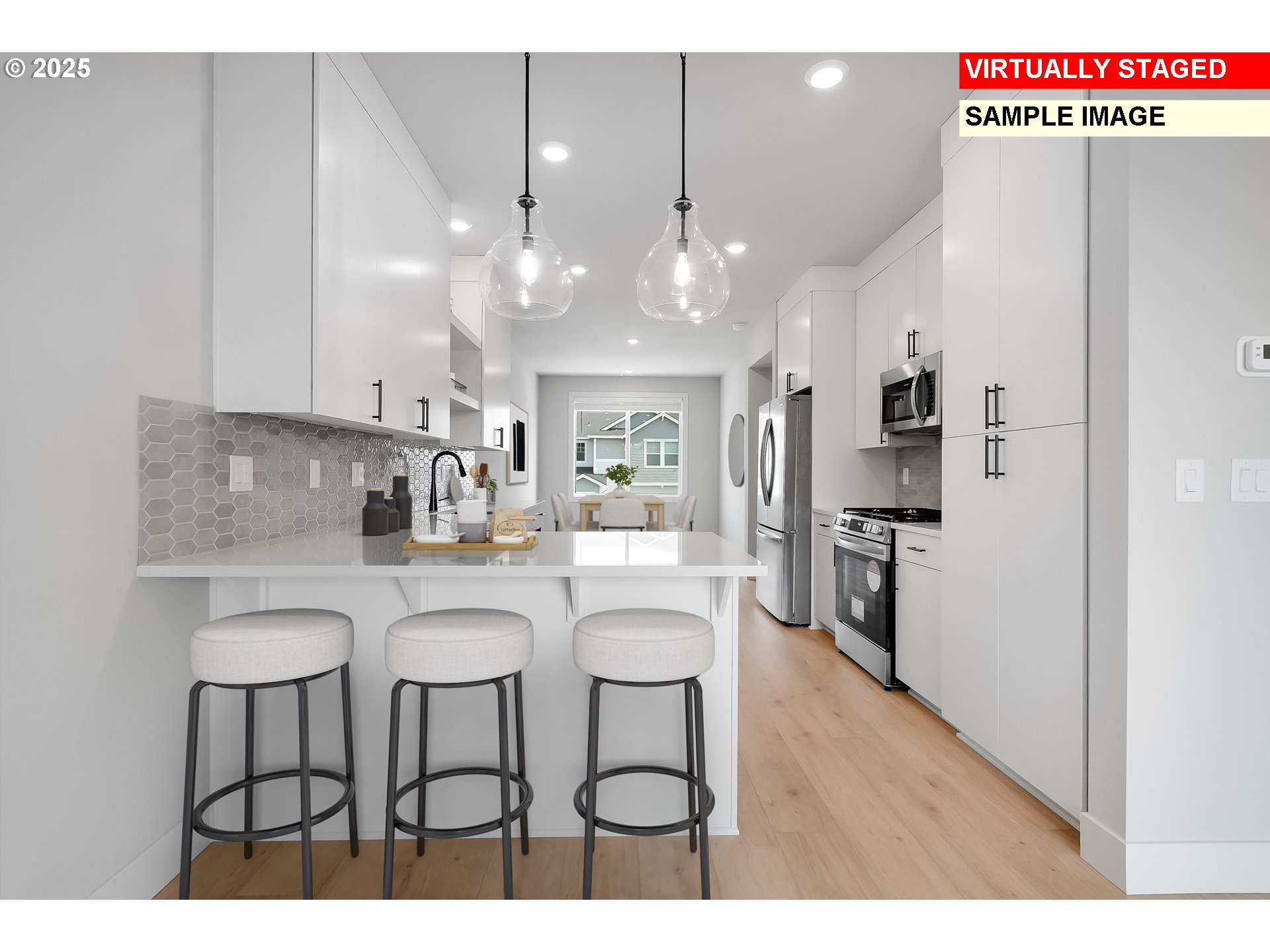 18620 Southwest Solitude Street Beaverton, OR 97007 - Photo 4 of 29 a kitchen with kitchen island granite countertop a sink cabinets and stainless steel appliances