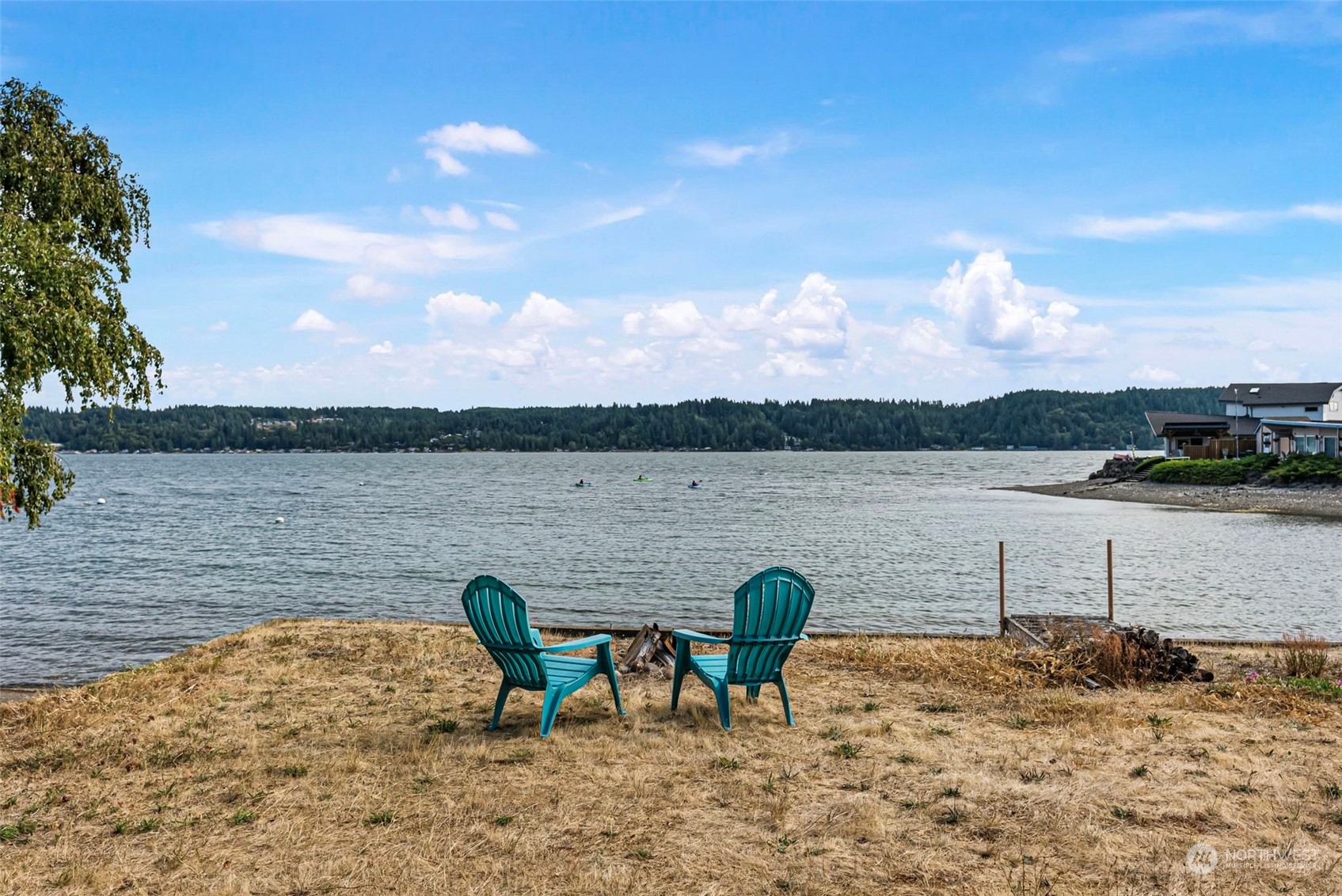 a view of a lake with outdoor seating