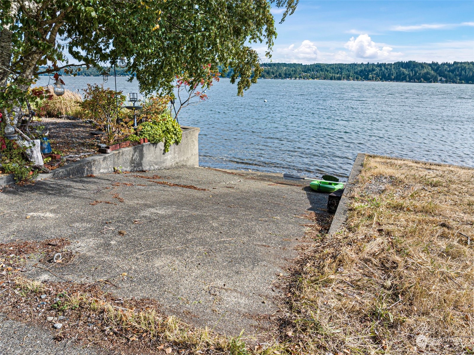 8101 Northeast North Shore Road Belfair, WA 98528 - Photo 3 of 8 a backyard of a house with lots of green space