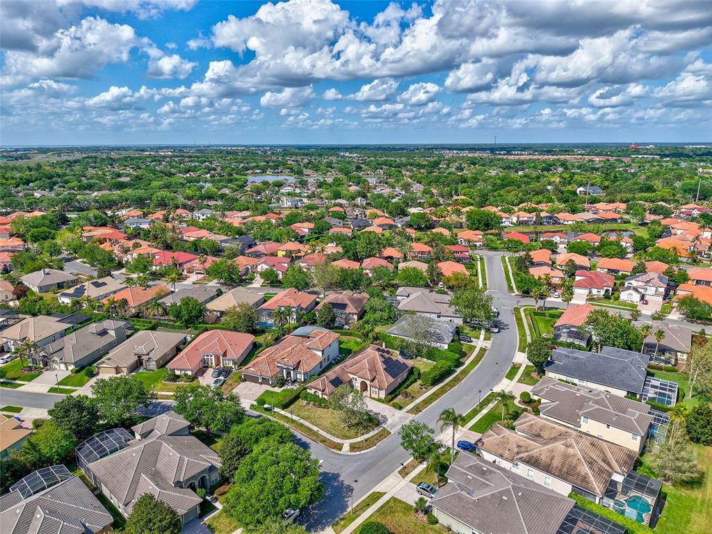 918 Algare Loop Windermere, FL 34786 - Photo 51 of 73 an aerial view of residential building with green space
