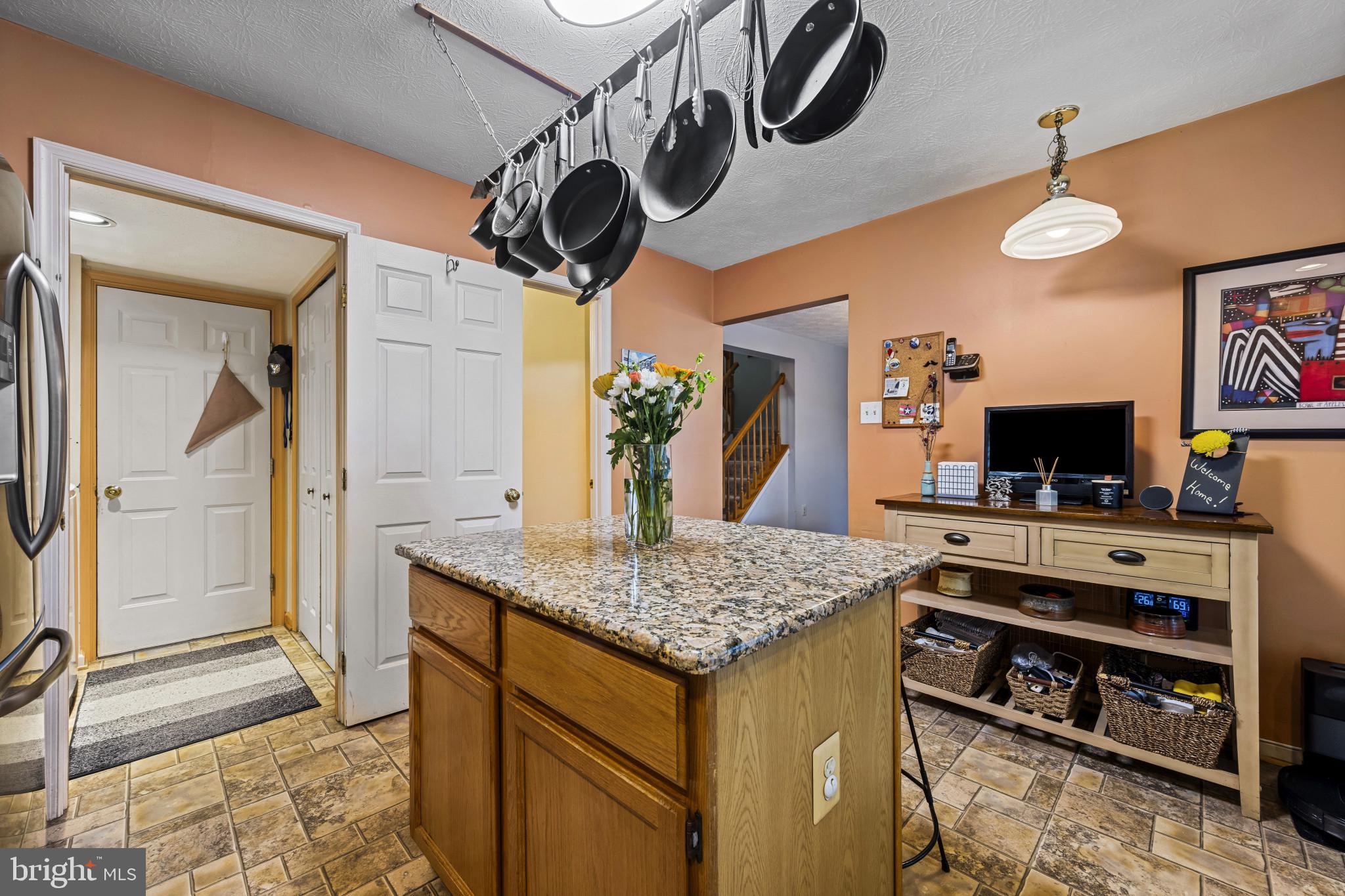 5 Wincrest Court Baltimore, MD 21208 - Photo 12 of 30 a kitchen with a stove and a wooden floor