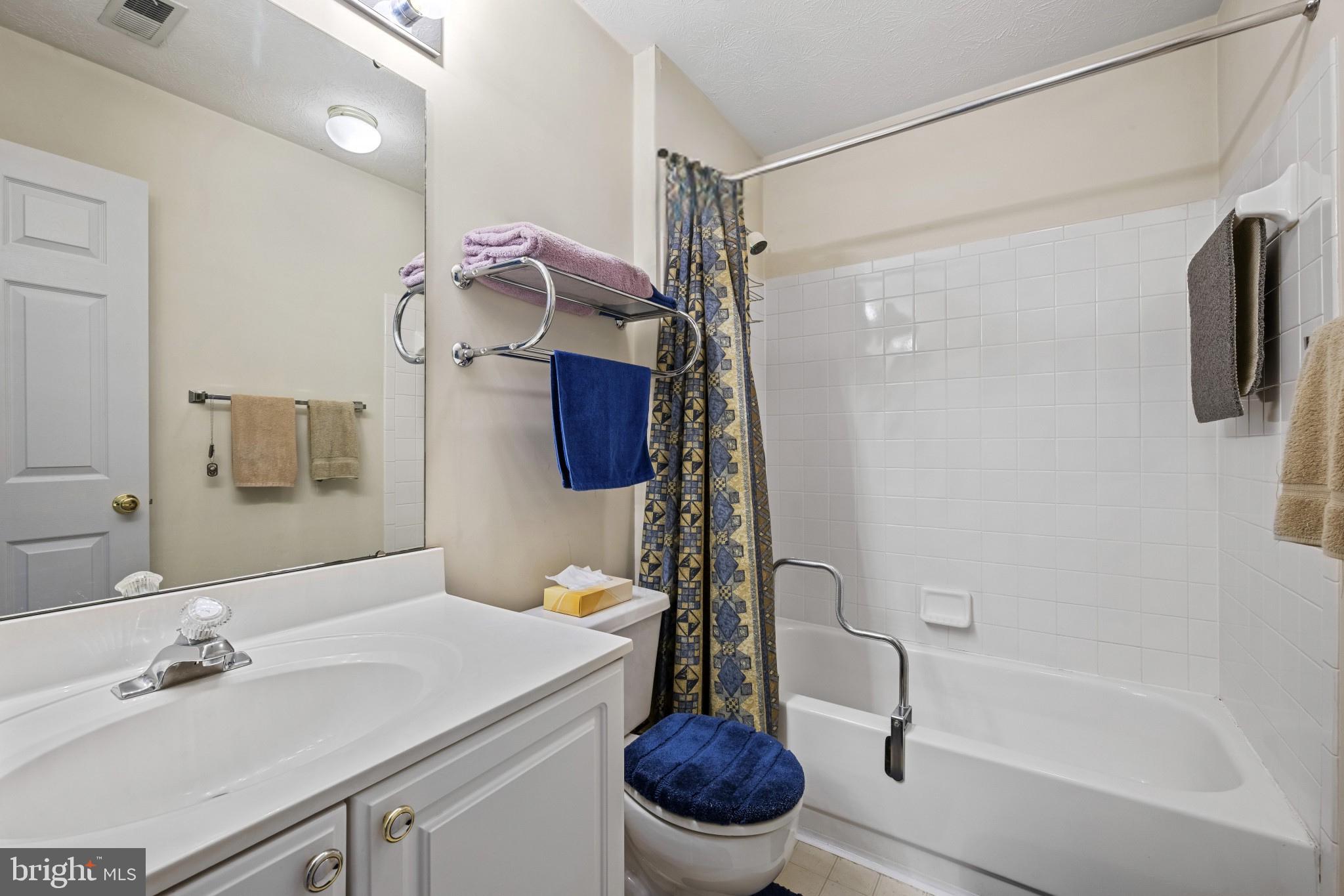 5 Wincrest Court Baltimore, MD 21208 - Photo 17 of 30 a bathroom with a sink toilet and shower