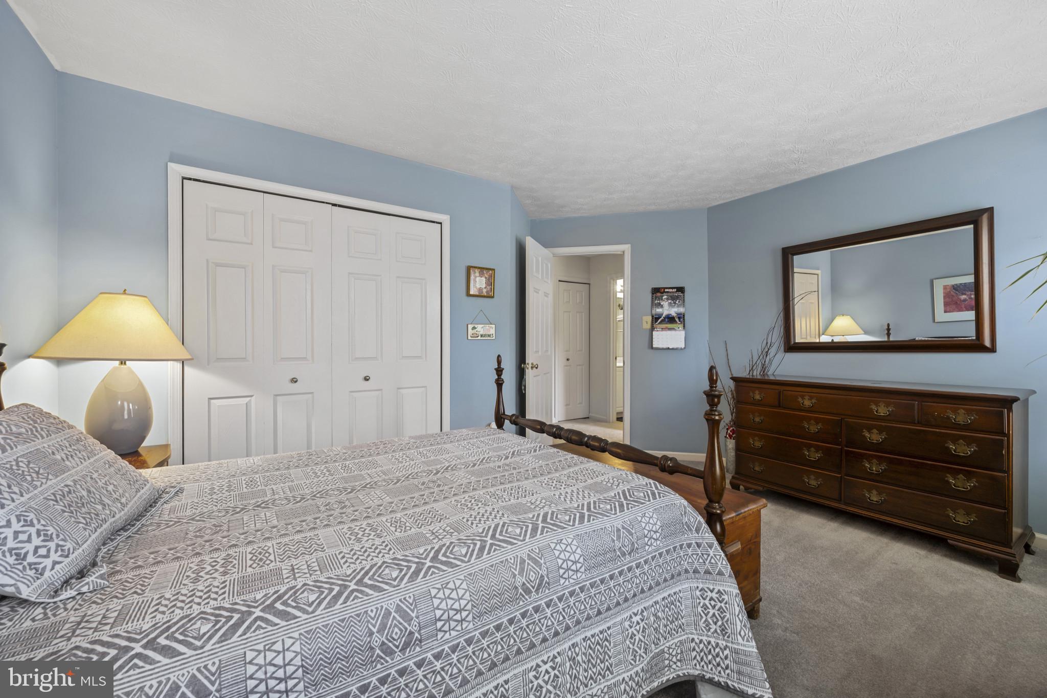 5 Wincrest Court Baltimore, MD 21208 - Photo 19 of 30 a bedroom with a bed and a dresser