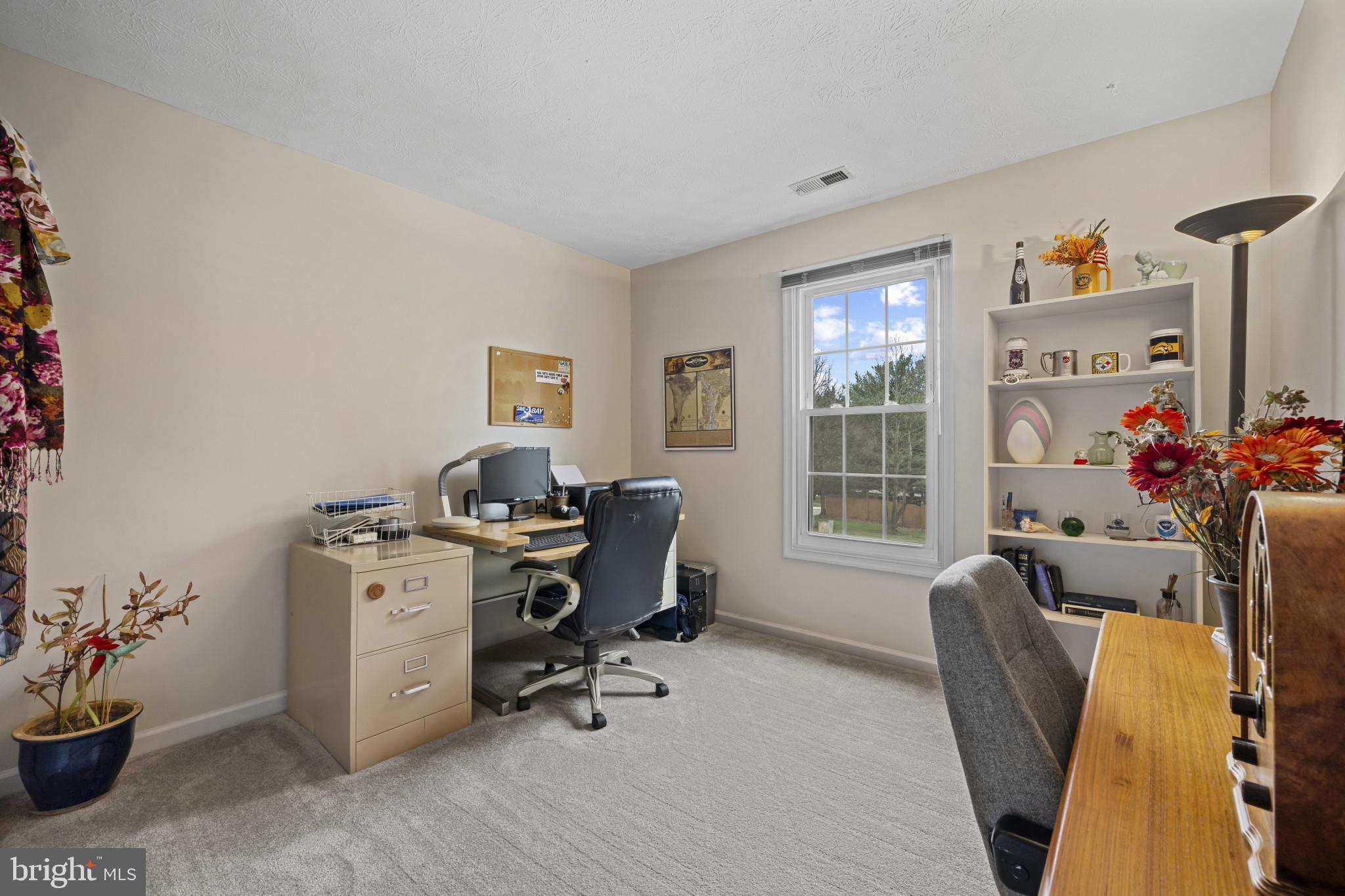 5 Wincrest Court Baltimore, MD 21208 - Photo 20 of 30 a view of a workspace with furniture and a window