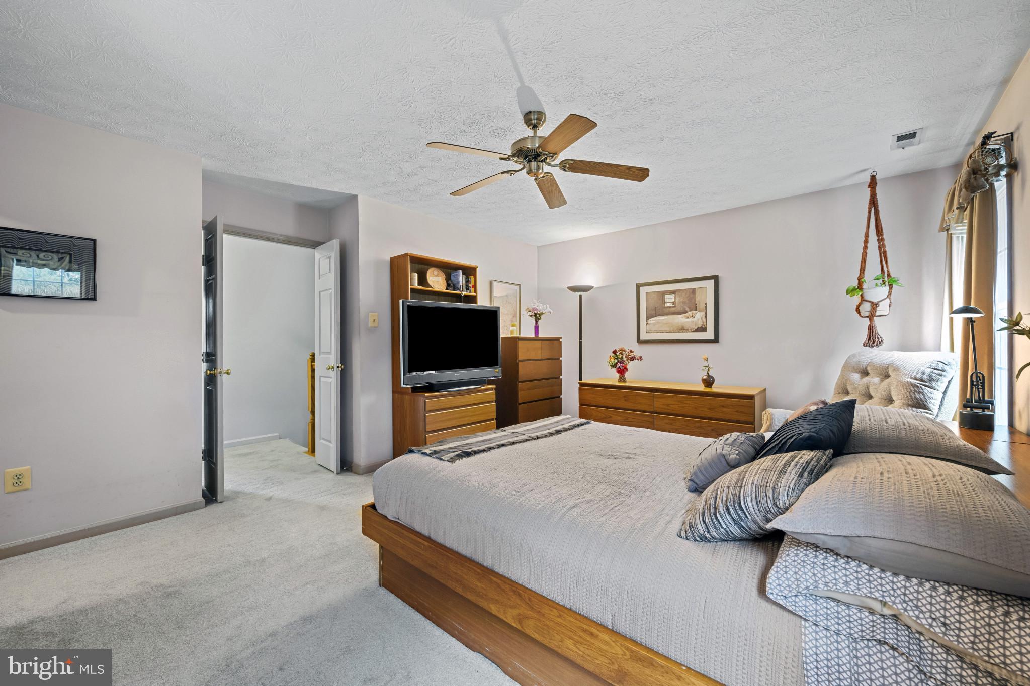 5 Wincrest Court Baltimore, MD 21208 - Photo 21 of 30 a bedroom with a bed and a flat screen tv