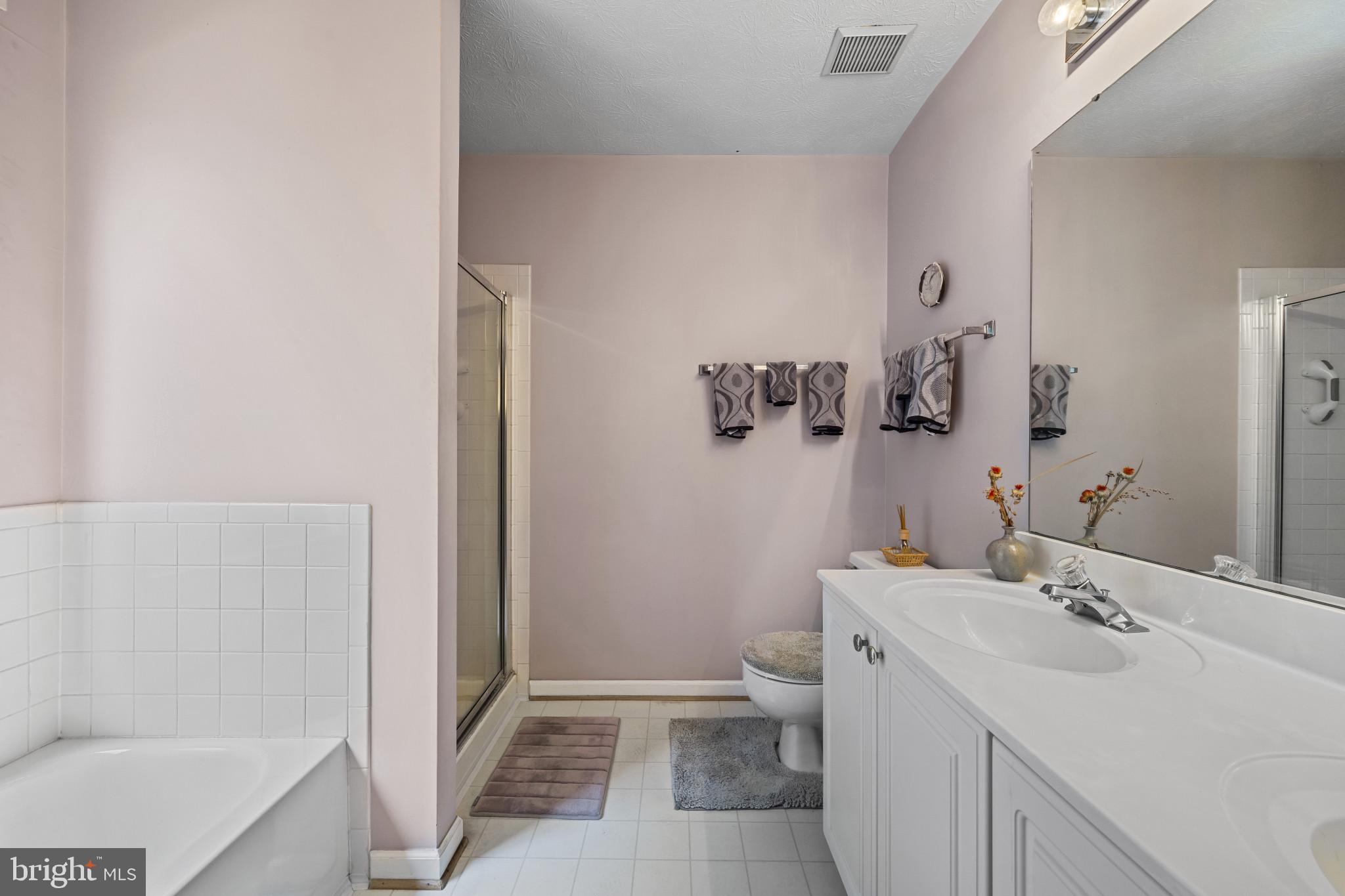5 Wincrest Court Baltimore, MD 21208 - Photo 23 of 30 a bathroom with a sink toilet and shower