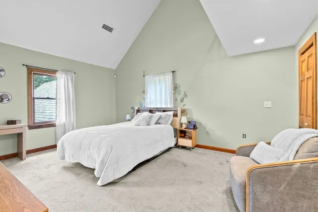 a bedroom with a bed and window