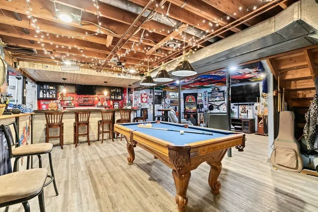 a view of a swimming pool with a table and chairs