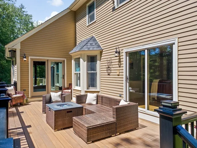 a view of a house with a large window and wooden floor