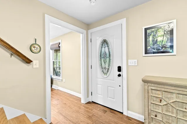a view of entryway with wooden floor
