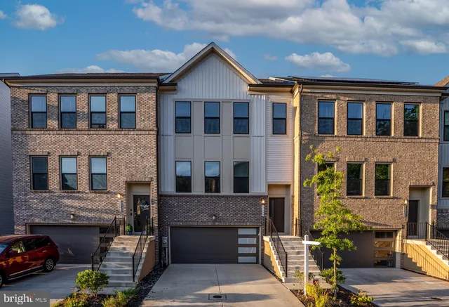 a view of building with car parked