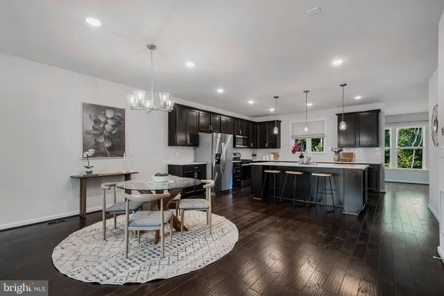 a open kitchen with a table and chairs in it