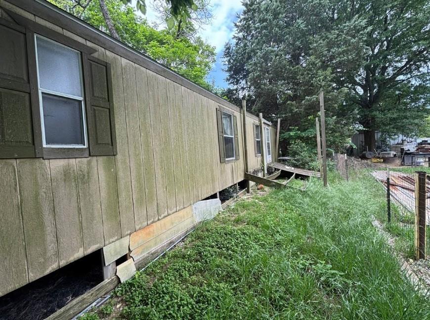 407 Magnolia Street Athens, TX 75751 - Photo 2 of 4 Single-story structure with vertical siding and window shutters