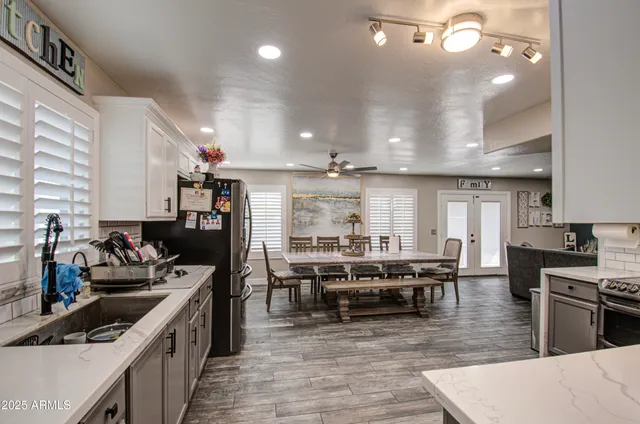a kitchen with lots of counter top space and stainless steel appliances
