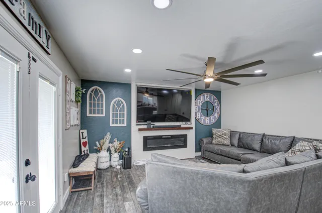a living room with furniture and a flat screen tv