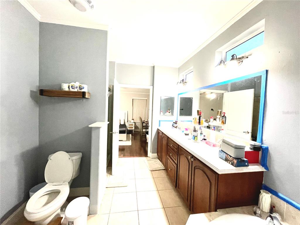 35495 Singletary Road Myakka City, FL 34251 - Photo 12 of 74 a living room with furniture potted plant and bathroom view