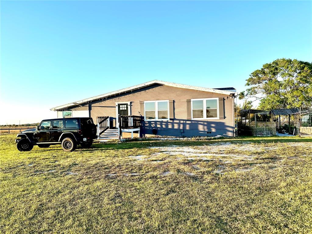 35495 Singletary Road Myakka City, FL 34251 - Photo 2 of 74 a view of a house with pool porch and sitting area