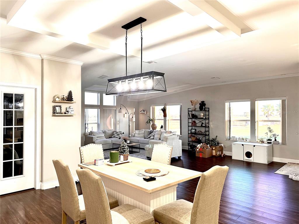 35495 Singletary Road Myakka City, FL 34251 - Photo 25 of 74 a view of a dining room with furniture window and wooden floor