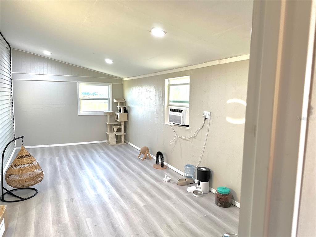 35495 Singletary Road Myakka City, FL 34251 - Photo 26 of 74 a view of empty room with wooden floor