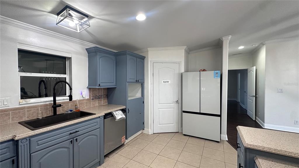35495 Singletary Road Myakka City, FL 34251 - Photo 30 of 74 a kitchen with granite countertop a refrigerator and a sink